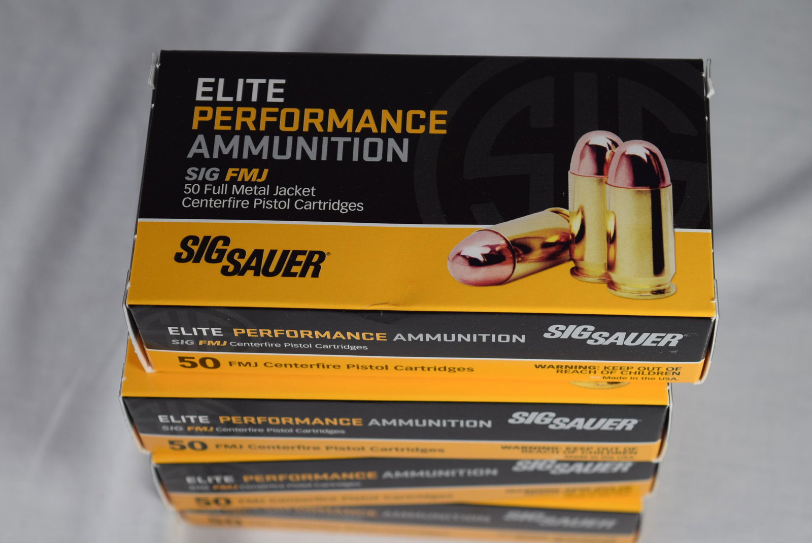 Four Boxes Sig Sauer 9mm 50 FMJ Centerfire Pistol: Four brand new boxes of Sig Sauer 9mm luger 115 gr. FMJ elite performance ammunition. 50 cartridges per box. Full boxes. As always please see all photos for more detail and ask any questions prior to 