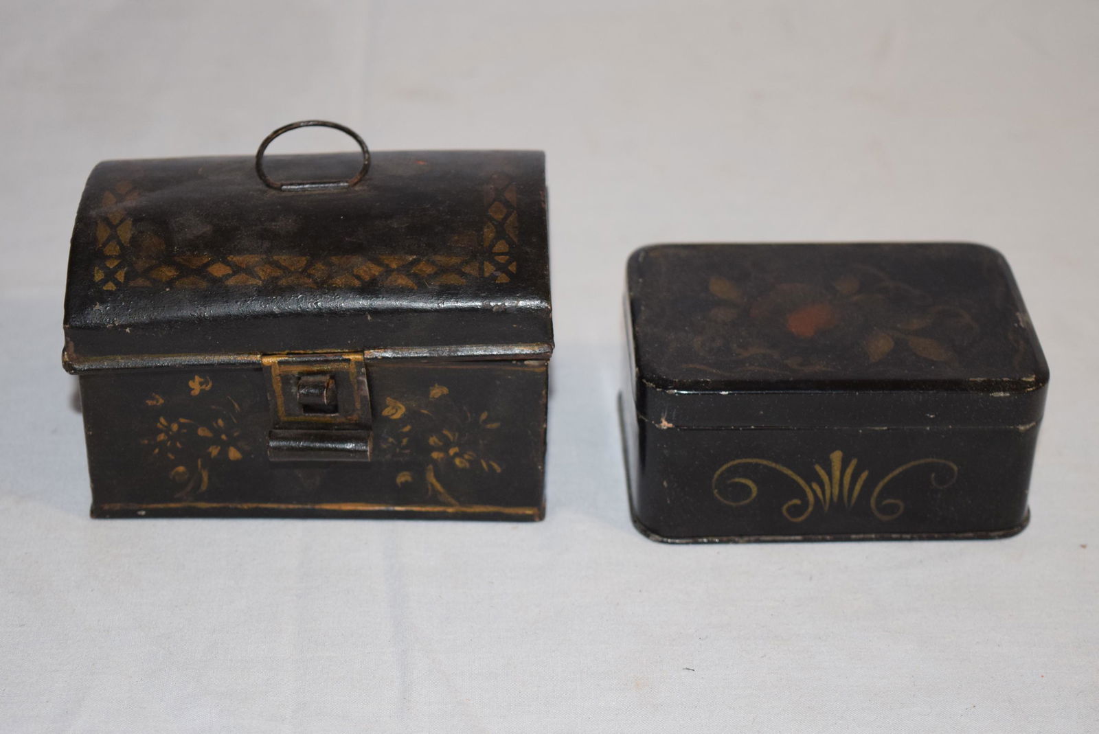 Two Vintage Paint Decorated Tin Tole Boxes: This lot includes miniature tin tole dome top box with latch that measures 4in x 2.75in x 2.75in T overall. Some minor imperfections, mentioned for clarity. Second in the lot is a miniature rectangula