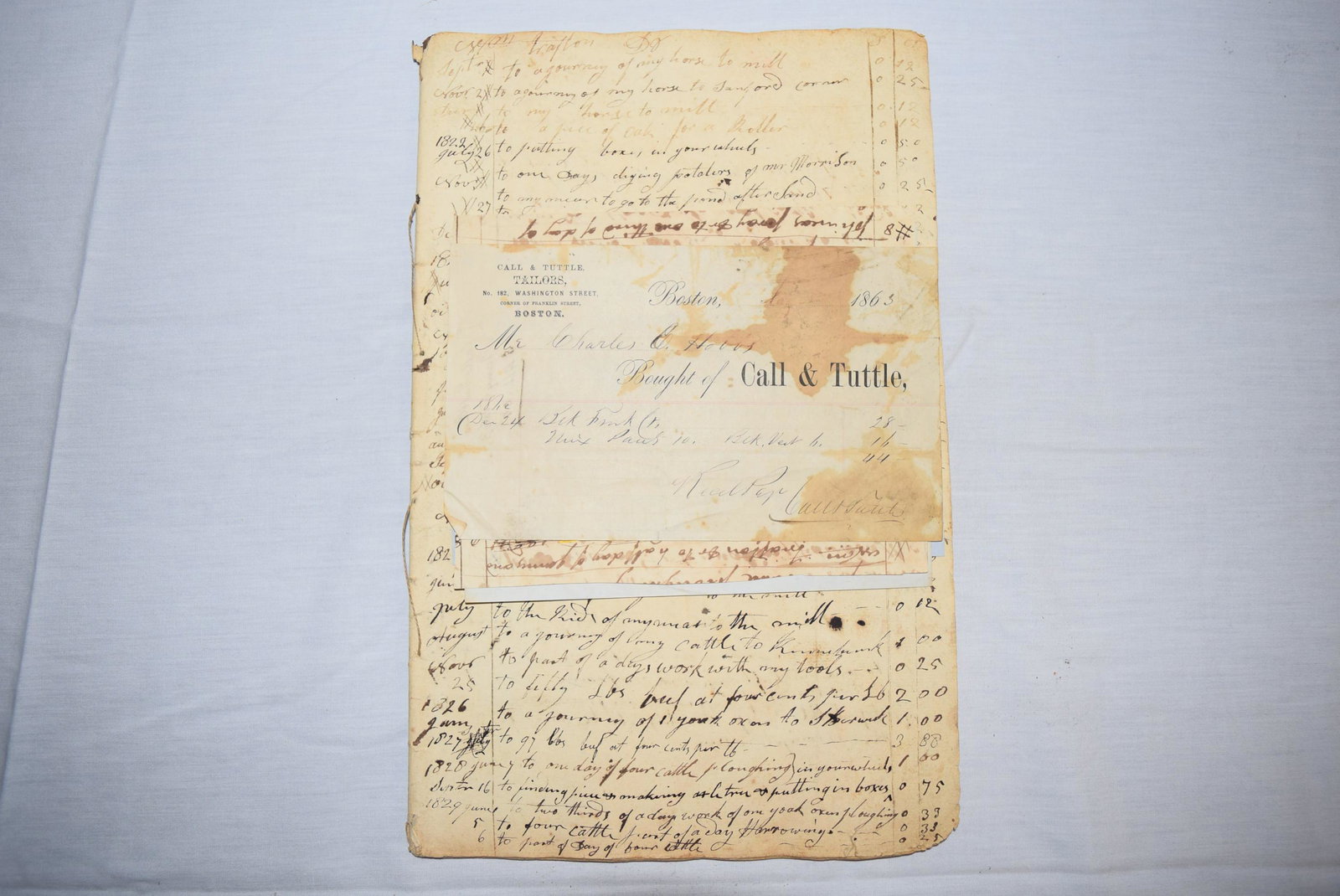 1800s Ledger and Receipts: This lot includes an early 1800s ledger; dating as early as 1821 features what appears to be someone's personal accounting ledger, detailing purchases made on different items, labor pay and so forth. 