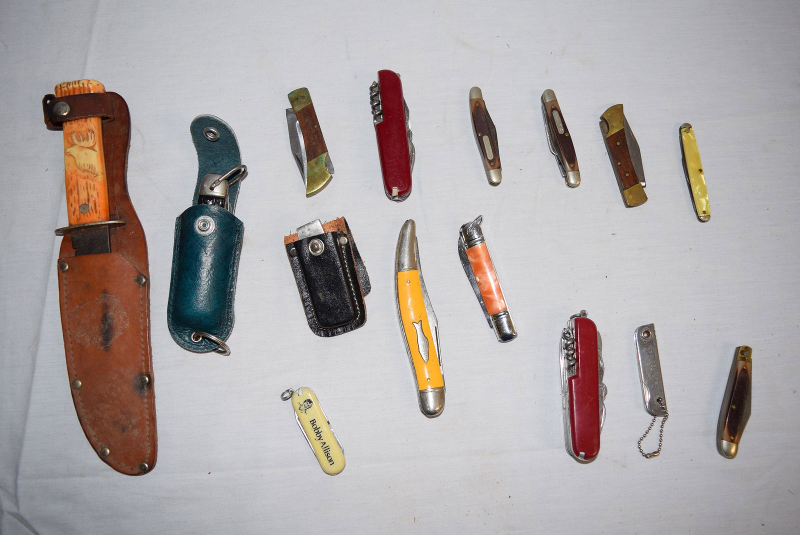 Lot of Pocket Knives: Lot includes two swiss army knives, 3 Old Timer knives, and 10 other assorted knives. Largest measuring 10in L, smallest 2.5in L overall. All are in good used condition. Some knives have minor imperfe