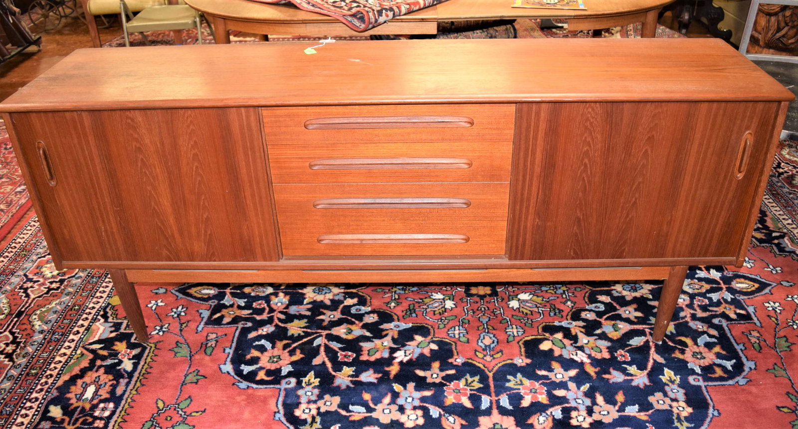 Mid Century Modern Troeds Bjarnum Credenza: Mid century modern credenza/sideboard/entertainment unit measures 75.5in L x 17.5in D x 31.25in T overall. Features two sliding doors on each side with four drawers in the center. The two top drawers 