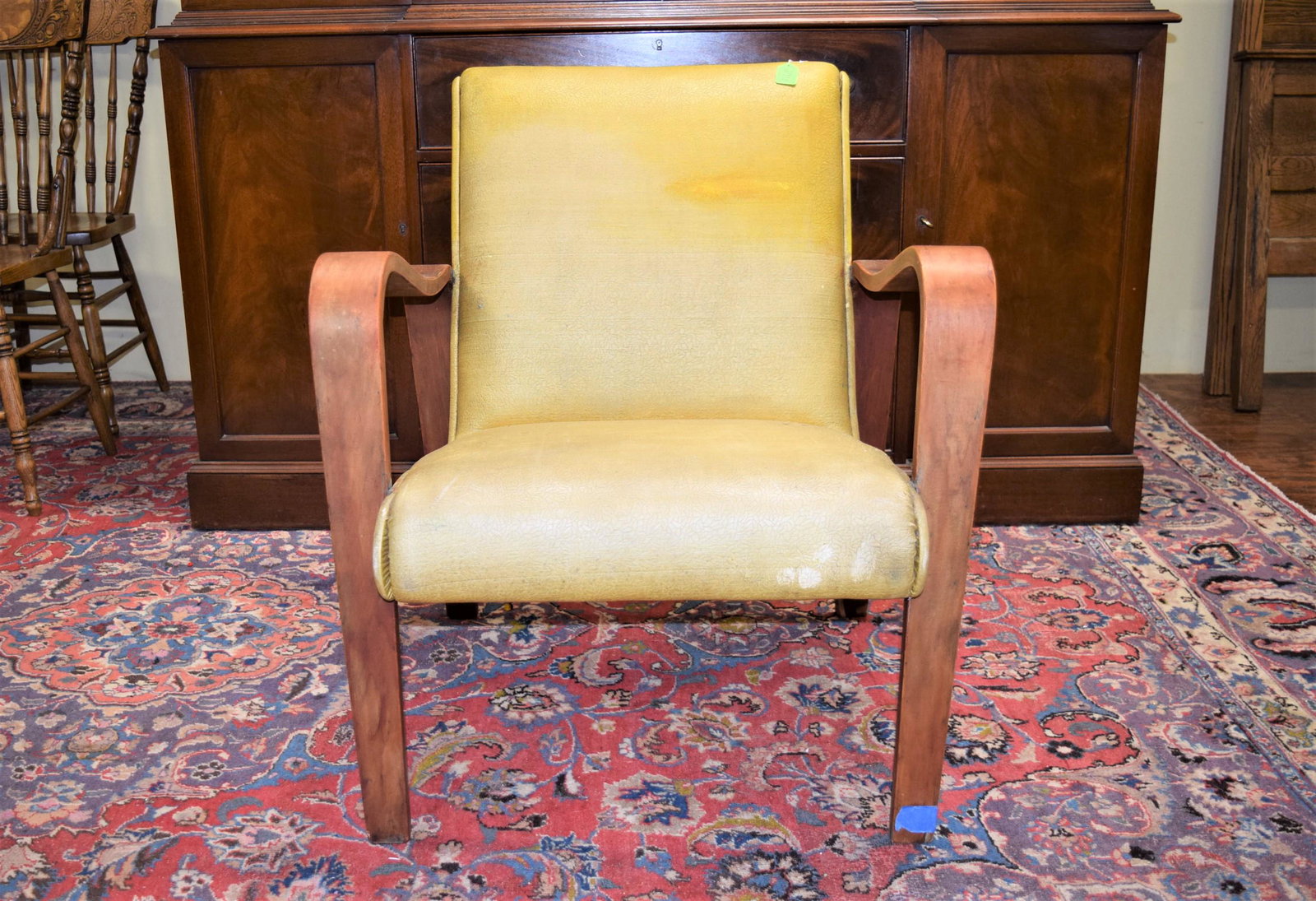 Vintage Mid Century Modern Arm Chair: This mid century modern arm chair measures 31in T x 27in W x 17in T floor to seat x 18in D overall. The upholstery is faded and has a couple small tears, the back could use some staples to tighten it 