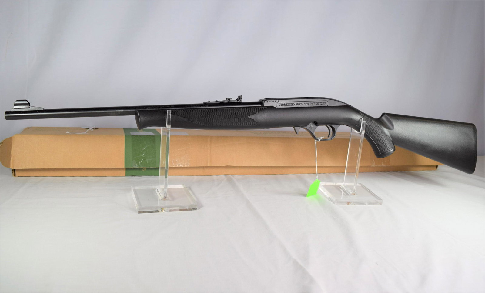 Mossberg 702 Plinkster Rifle .22 Caliber: Mossberg model 702 Plinkster rifle .22 caliber, serial number: EHH403558. 18in barrel. New old stock in the original box with gun lock and information packet included. Gun appears to function as it sh