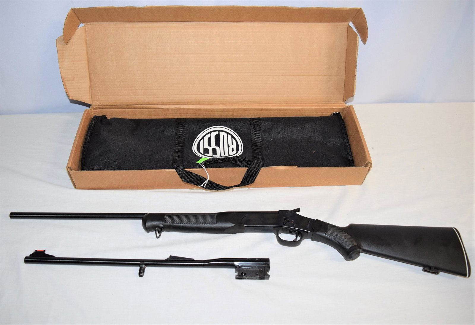 Rossi Firearms .410-.22 Combo Youth Model: Rossi Firearms .410/.22 combo youth model. New old stock in original box and carrying case. SERIAL NUMBER: SR005616. BARRELS: 410-22in L, .22LR- 18.5in L overall. The original plastic and foam packagi
