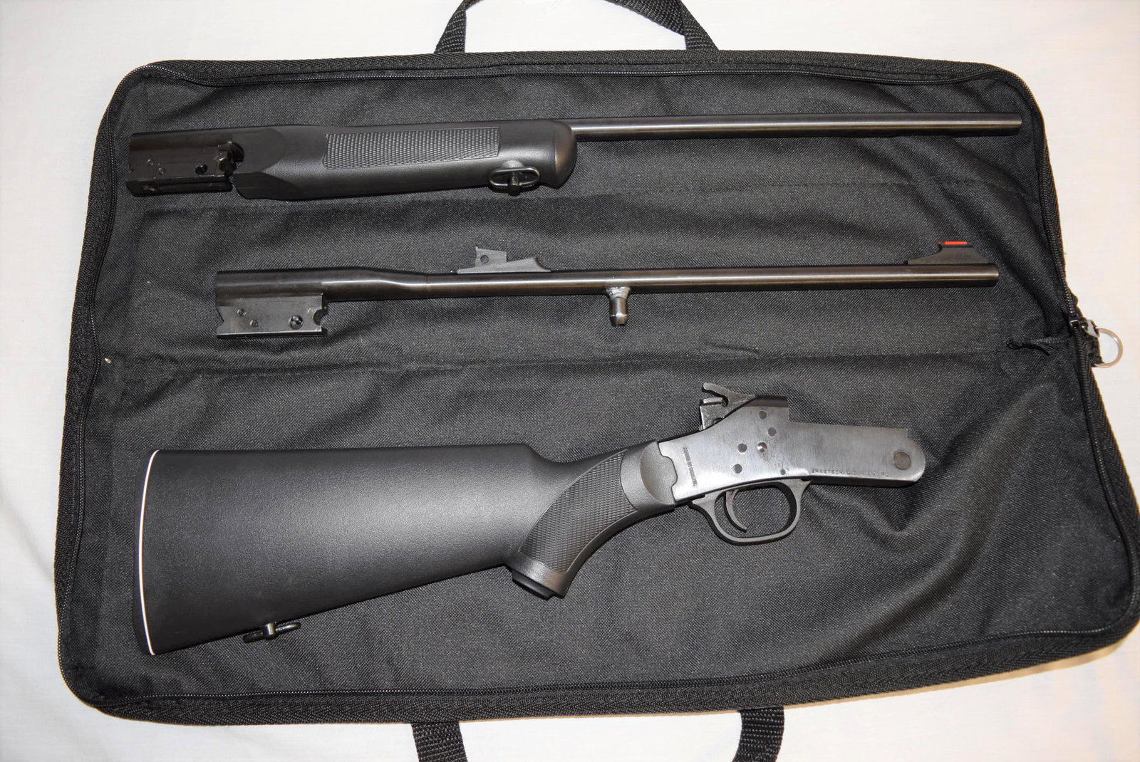 Rossi Firearms .410-.22 Combo Youth Model: Rossi Firearms .410/.22 combo youth model. New old stock in original box and carrying case. SERIAL NUMBER: SP900329. BARRELS: 410-22in L, .22LR- 18.5in L overall. The original plastic and foam packagi