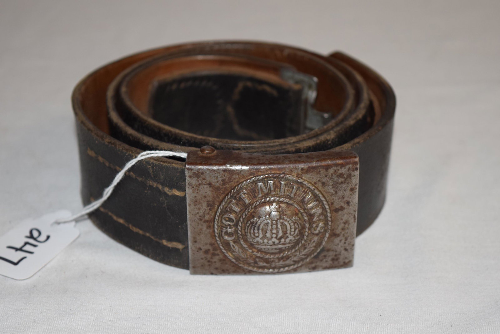 Original WWI German Military Issue Belt Buckle: Authentic Original WW1 German Prussia Military Issue Gott Mit Uns (which translates to "God Is With US") Belt Buckle and Buckle. The belt measures 39in L x 1.75in W overall. The belt buckle measures 2