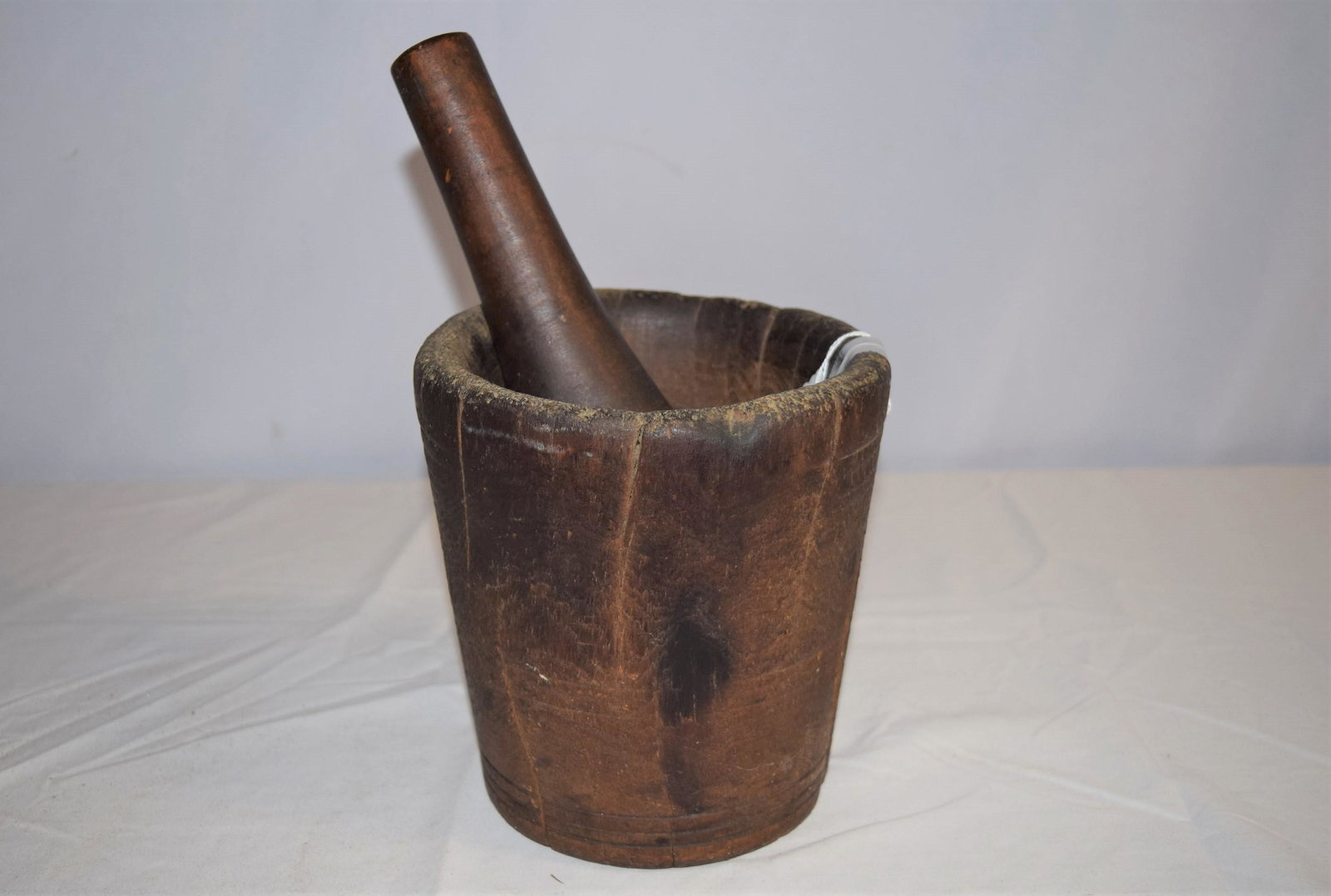 Large Early Mortar and Pestle: Large early mortar and pestle, mortar measures 6.5in T x 6in round. Pestle measures 9.25in L overall. Mortar has some stress cracks as you would expect due to age. Pestle in good condition, shows norm