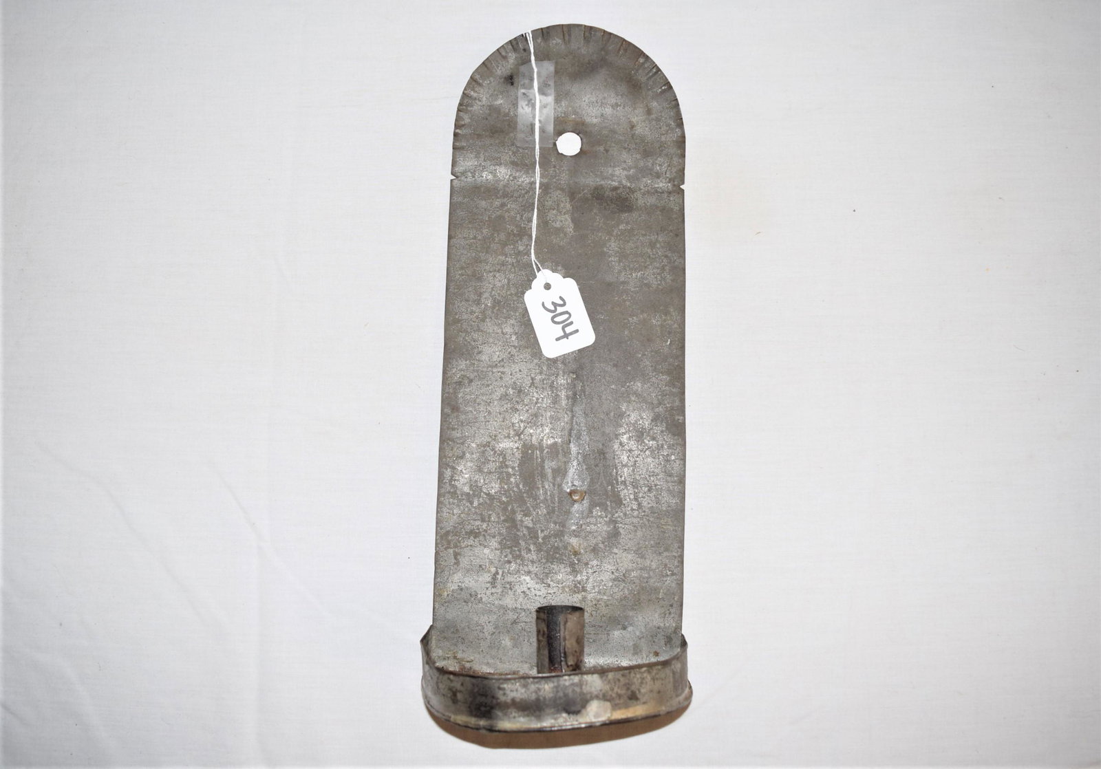 Antique Tin Candle Sconces: Antique tin candle wall sconce that measures 13.25in T x 5in W x 3.25in D overall. This candle sconce is in great overall condition, normal antique condition, handling ware. Displays nicely and would 