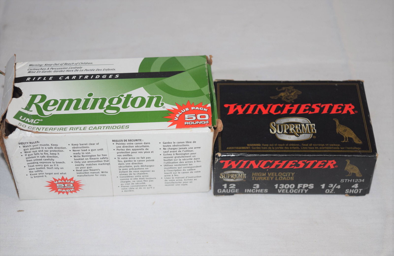 Lot of Ammunition: Lot of ammunition includes one box of Remington 223 ammunition, 55 GR, value pack, 50 rounds in box. Box is ripped on one side. The second box is Winchester supreme 12 GA, 3 inches, 1300 FPS velocity,
