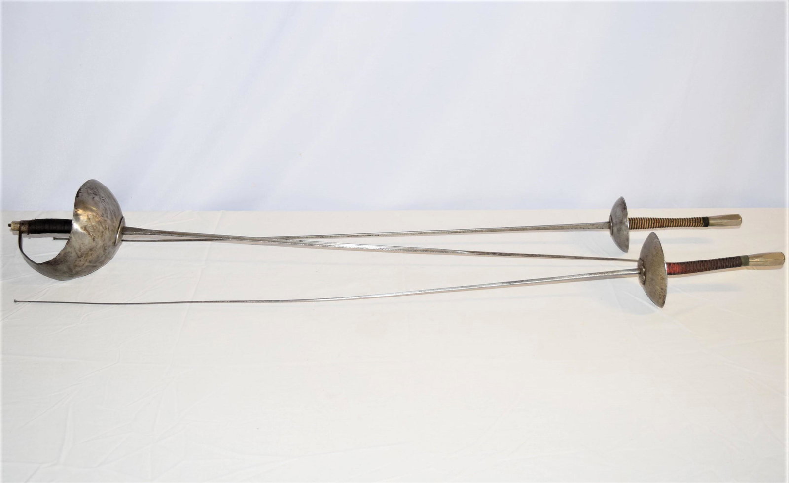 Turn of the Century French Fencing Lot: Turn of the Century French Fencing Sword Lot. Two are stamped at the base of the sword, as shown. All swords and grips appear to be in good overall condition. The base of one of the swords does have a