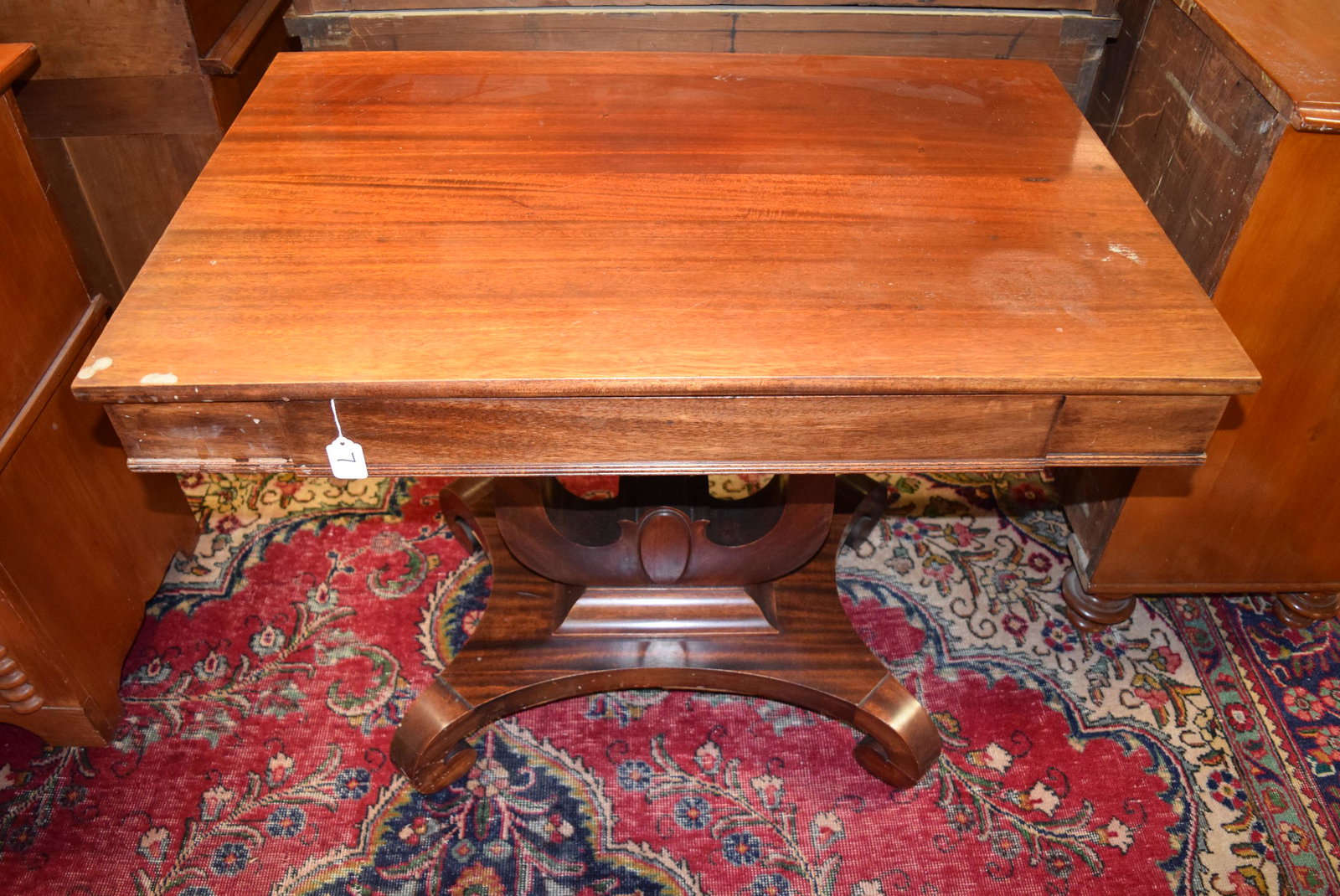 Antique MAH Table: Antique MAH table measures approx. 23.75in x 36in on top x 29in T overall There is some water spots and scratches as well as some white stain spots. The very bottom of the base has the wood lifting a