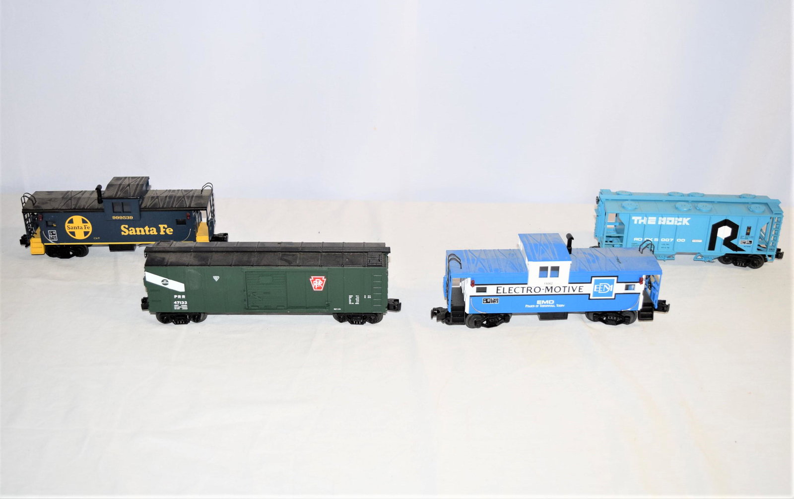 Lot of MTH Electric Trains: This lot includes 4 MTH Electric trains. FIRST: Santa Fe Ce-7 #999539, measures 10.5in L x 3.5in x 2.5in overall. SECOND: The Rock #500700, BLT 8-62, measures 10in L x 2.5in x 3.5in overall. THIRD: PR