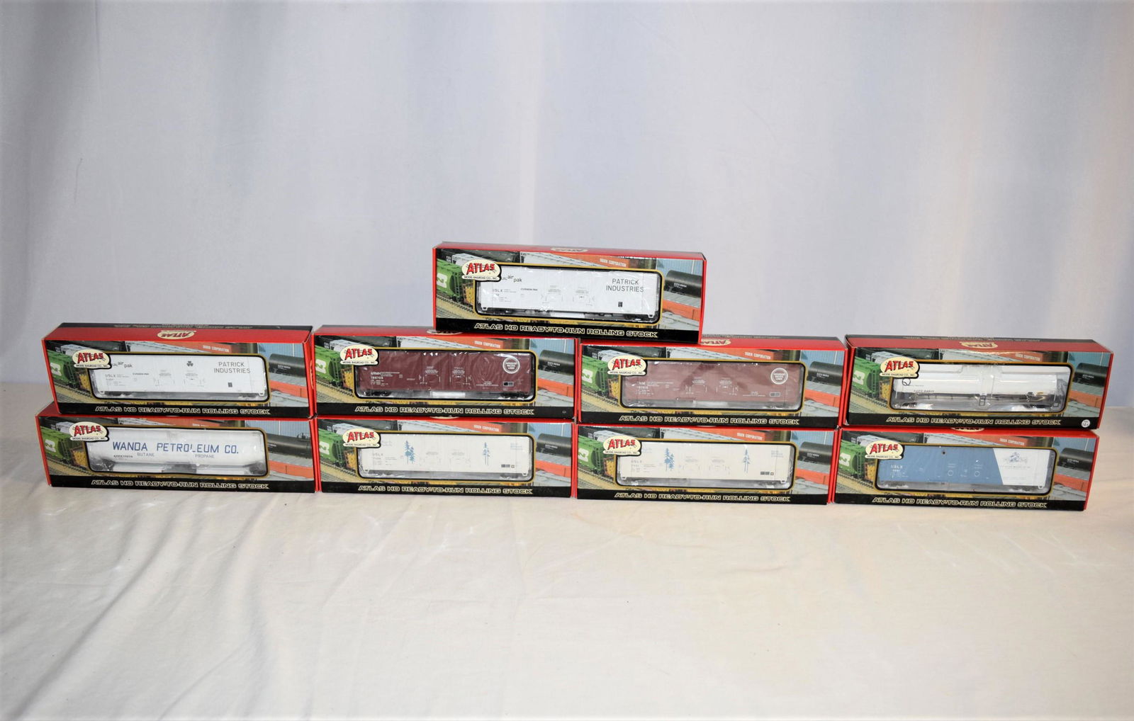 Lot of Atlas Model Railroad Box Cars/Tank Cars: This lot includes 9 trains, all in the original boxes/packaging. HO scale. FIRST: #1768-1 Evans DPD Box Car Missouri Pacific #786709. SECOND: #1769-1 Evans DPD Box Car Patrick Industries #11150. THIRD