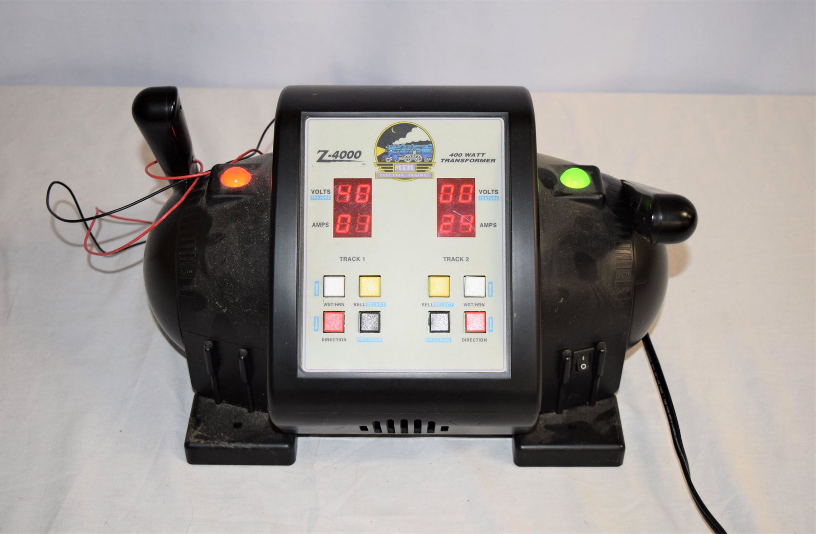 MTH Z-4000 Transformer: MTH Electric Trains Z-4000, 400 Watt Transformer. SERIAL NO. 119854483. AC Input: 120V, 60 Hz. Auction company did not test item however no mechanical issues are known. Measures approx. 14in L x 9in T