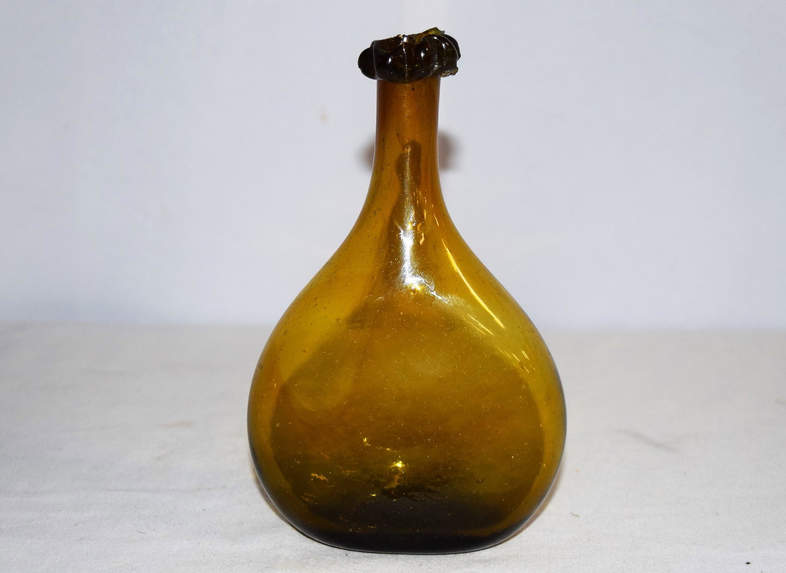 19th Century New England Chestnut Flask: 19th Century New England Chestnut Flask measures approx. 6.5in T overall, center is approx. 4in wide. Beautiful color, displays nicely. There are some minor imperfections around the top edge however t