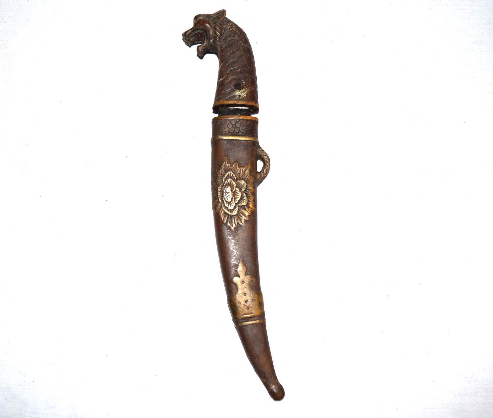 Ornate Oriental Dagger: Oriental Dagger features a handle shaped after a tiger roaring. Comes with a metal sheath with floral detail on either side. Blade and sheath need to be cleaned up and have rust and build up as shown