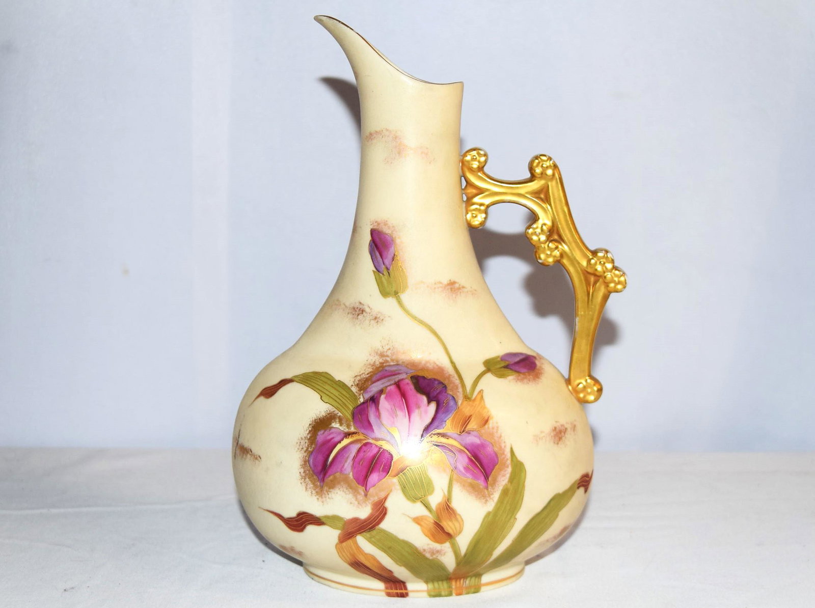 Rudolstadt Pottery Pitcher: Rudolstadt Pottery Pitcher with beautiful hand painted floral decoration from the late 1800s to early 1900s. Stamped in blue "RW" (Rudolstadt Works) inside a diamond with a crown on top, it is also em