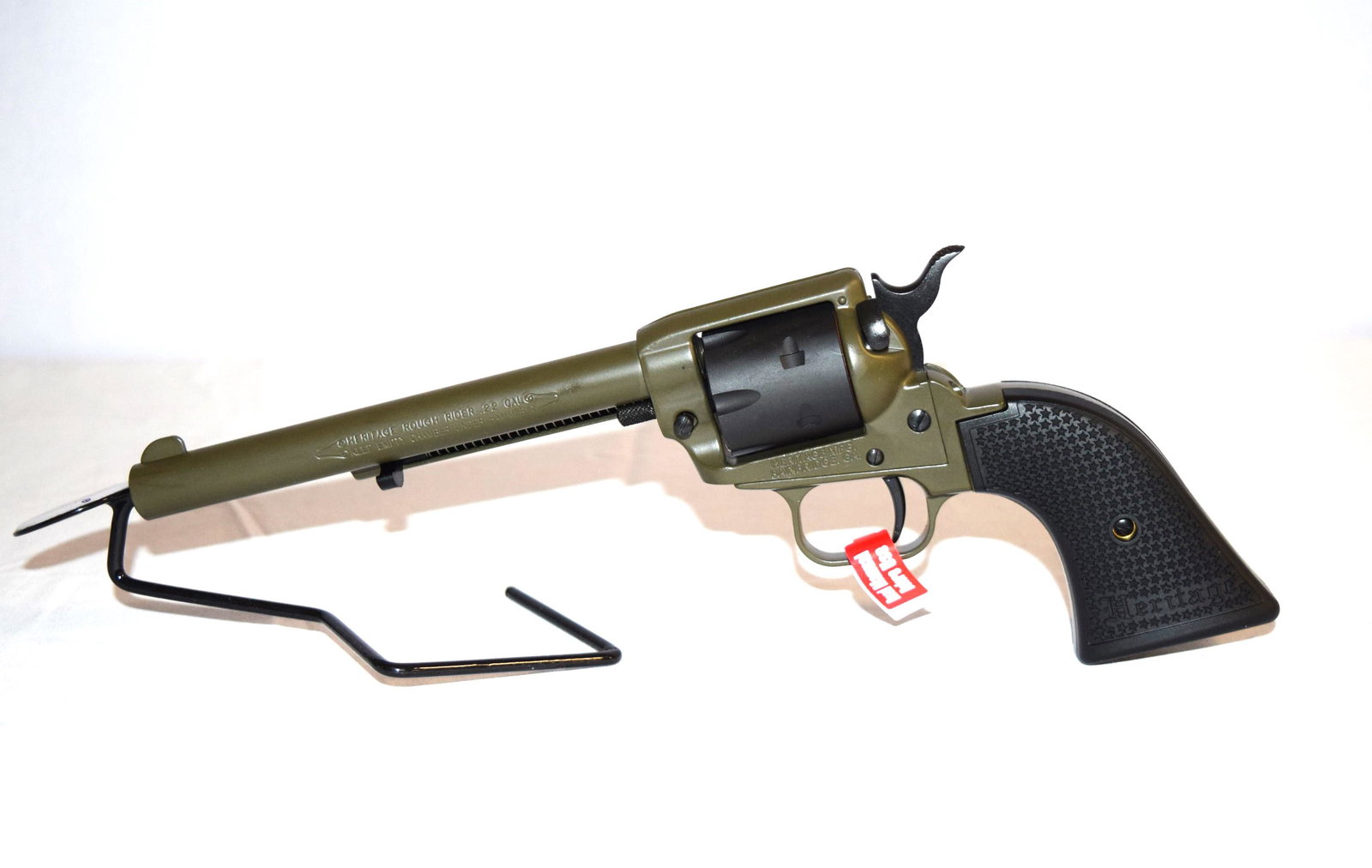 Heritage Rough Rider .22 Cal Revolver: NEW IN BOX Heritage Rough Rider Small-Bore .22 Cal 6 Round Revolver. 6.5 inch Barrel. Serial Number: 3PH234369. Comes with original packaging including instruction manual and lock. Firearm appears to 