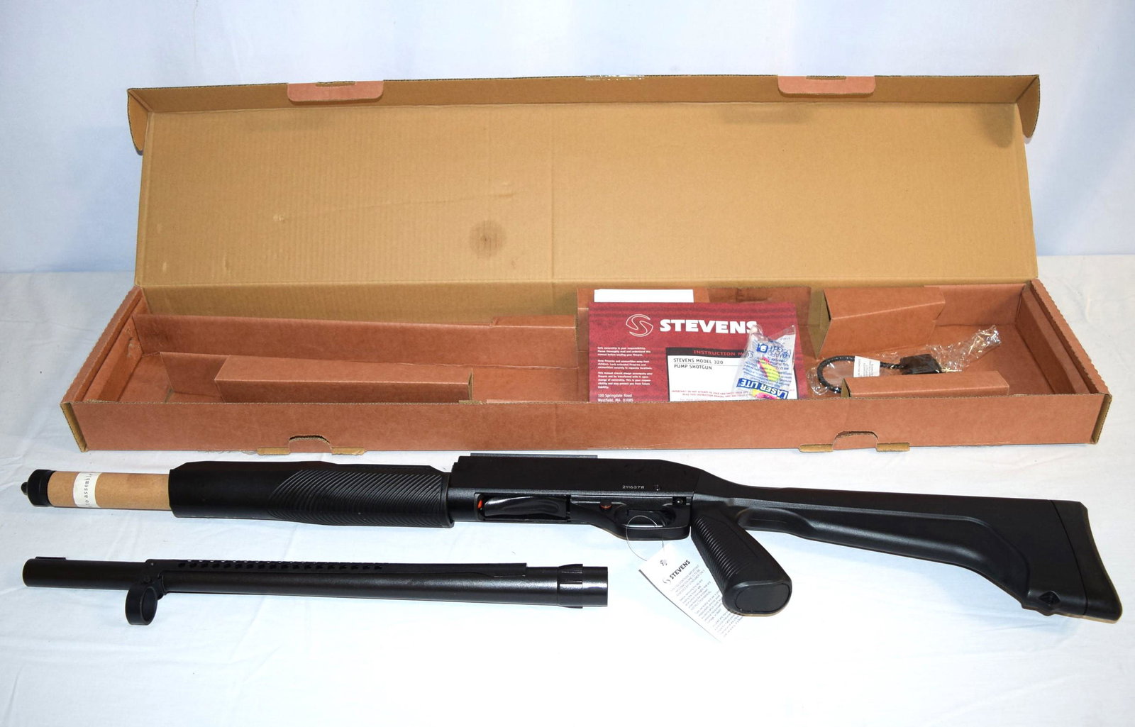 NEW Stevens Mod 320 12GA Shotgun: NEW Stevens Mod 320 12GA Pump Shotgun. 3 3/4 inch and 3 Inch Shells. Includes original box, instruction manual and lock. Serial Number: 211637W. Barrel Length: 19 inches. Firearm appears to function a