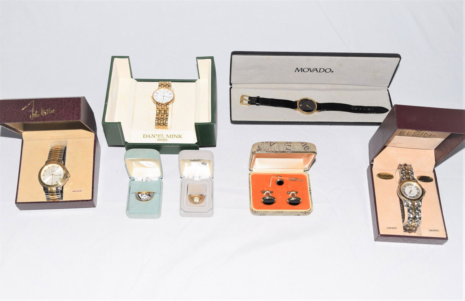 Lot of Misc. Jewelry and Watches: Lot of misc. jewelry and watches consist of 4 watches, 2 rings, set of cuff links and tie pin. Watch brands include: Movado, Elgin Swiss, Daniel Mink swiss, John Weitz. The cuff link set comes from J.
