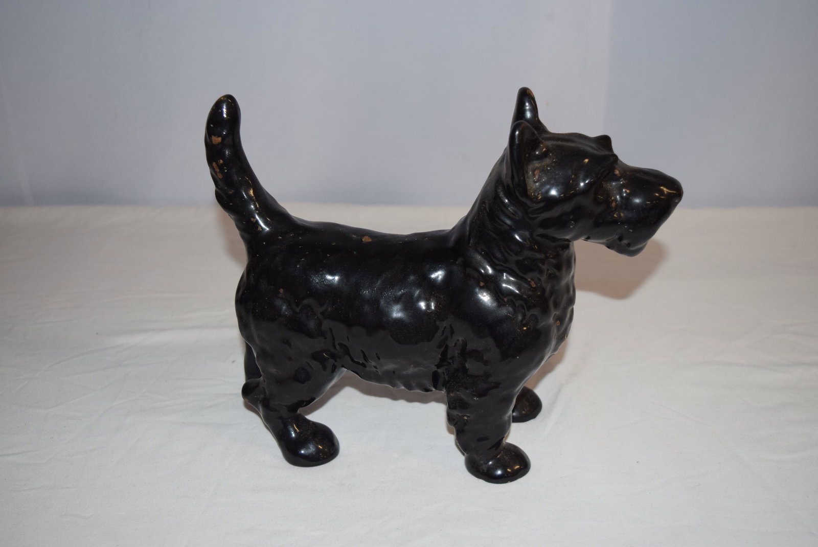 Vintage Enameled Black Scottish Terrier Cast Iron Doorstop: Vintage Enameled Black Scottish Terrier Cast Iron Doorstop measures 8.25 inches tall to the top of its ear X 10.5 inches long from nose to tail X 3.75 inches wide in front from foot to foot. Nice heav