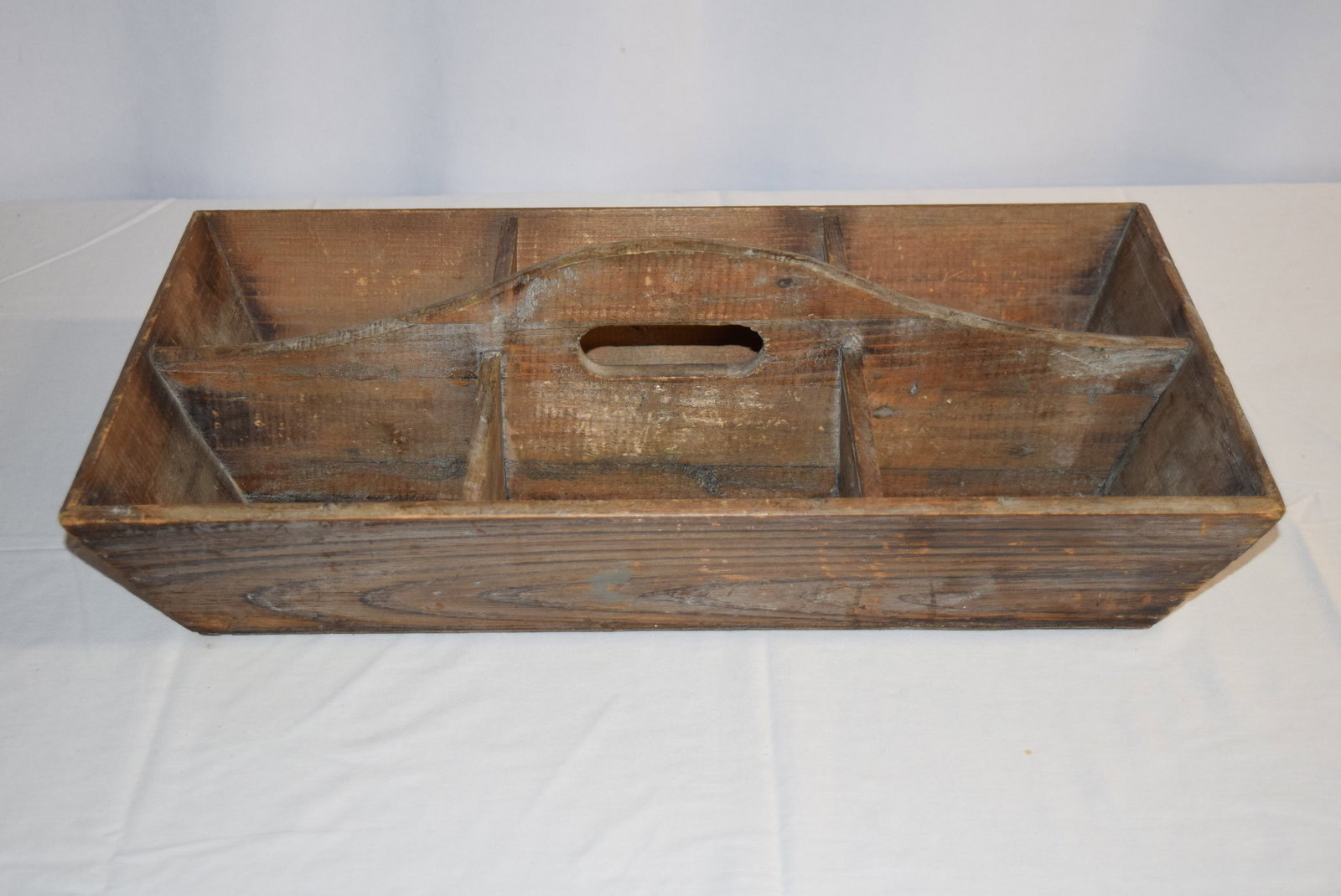 Antique Wooden Utensil Box: Antique Wooden Utensil Box measures approx. 12.75in W x 22in L x 4in T overall, not including handle. Normal ware for age, overall in good condition. All items are looked over but not inspected furthe