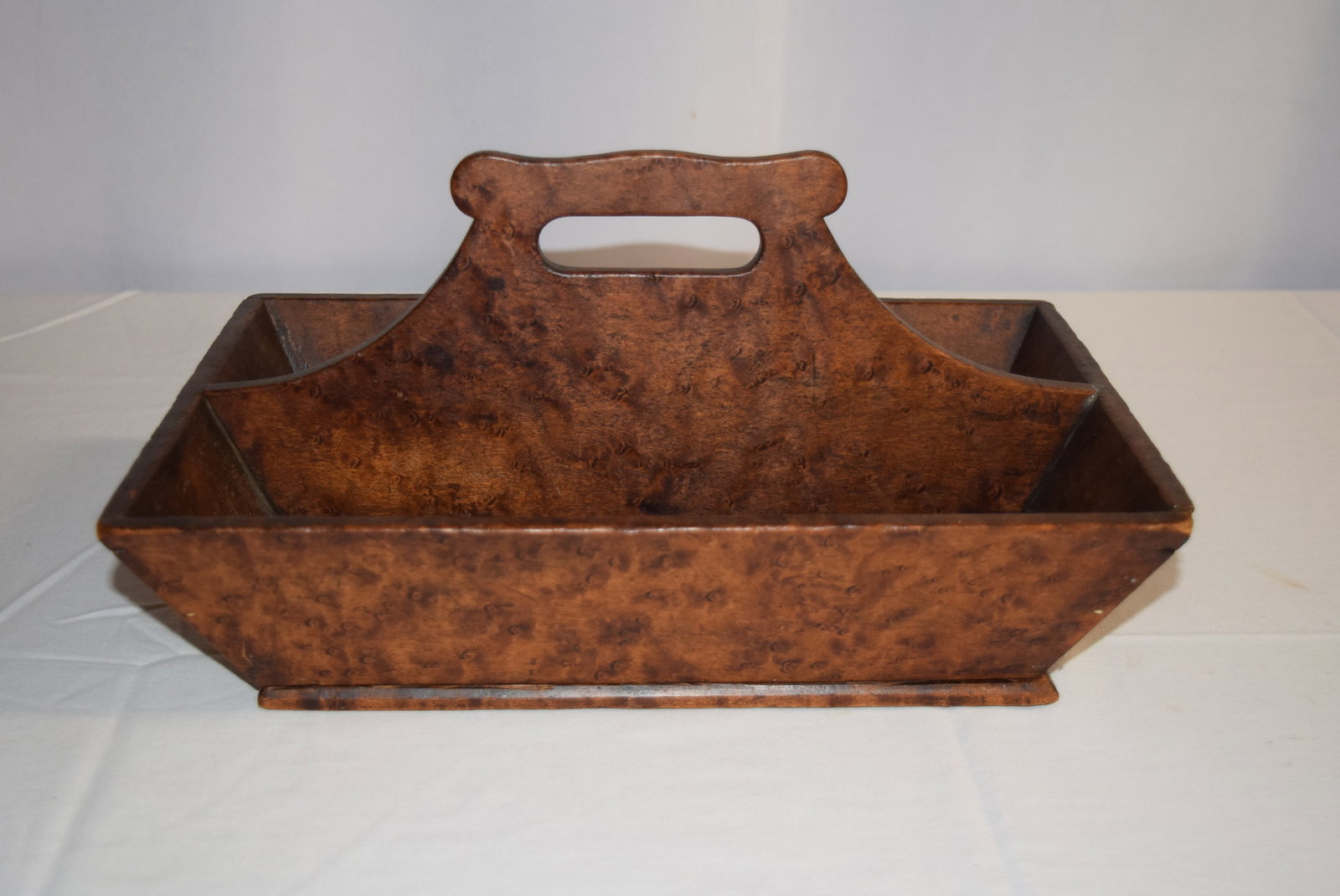 Antique Tiger Maple Knife Box: Antique Tiger Maple Knife Box that measures approx. 9in W x 14in L x 3.5in T not including handle. The bottom appears to have glue residue where it was secured at some point. Otherwise knife box appea