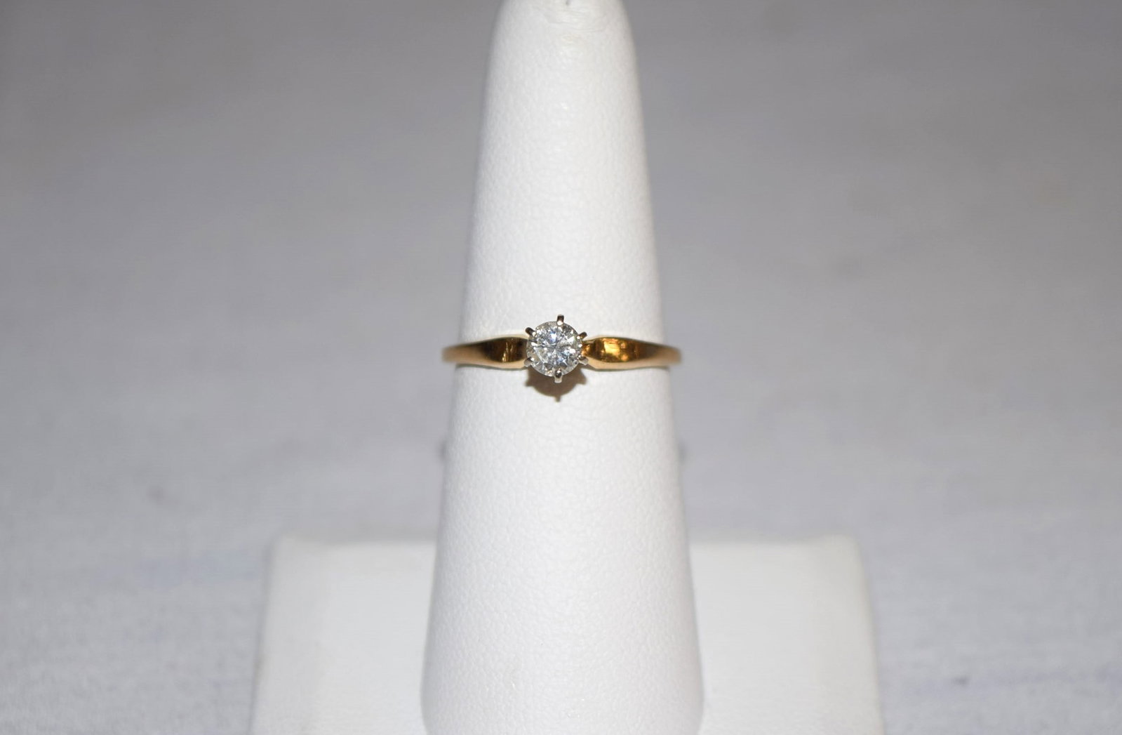 14K Yellow Gold Diamond Estate Ring: 14K Yellow Gold Diamond Estate Ring features a solitaire round cut diamond approximately 5mm round, in a six prong setting. This beautiful diamond was verified by a local jeweler. The band is marked, 