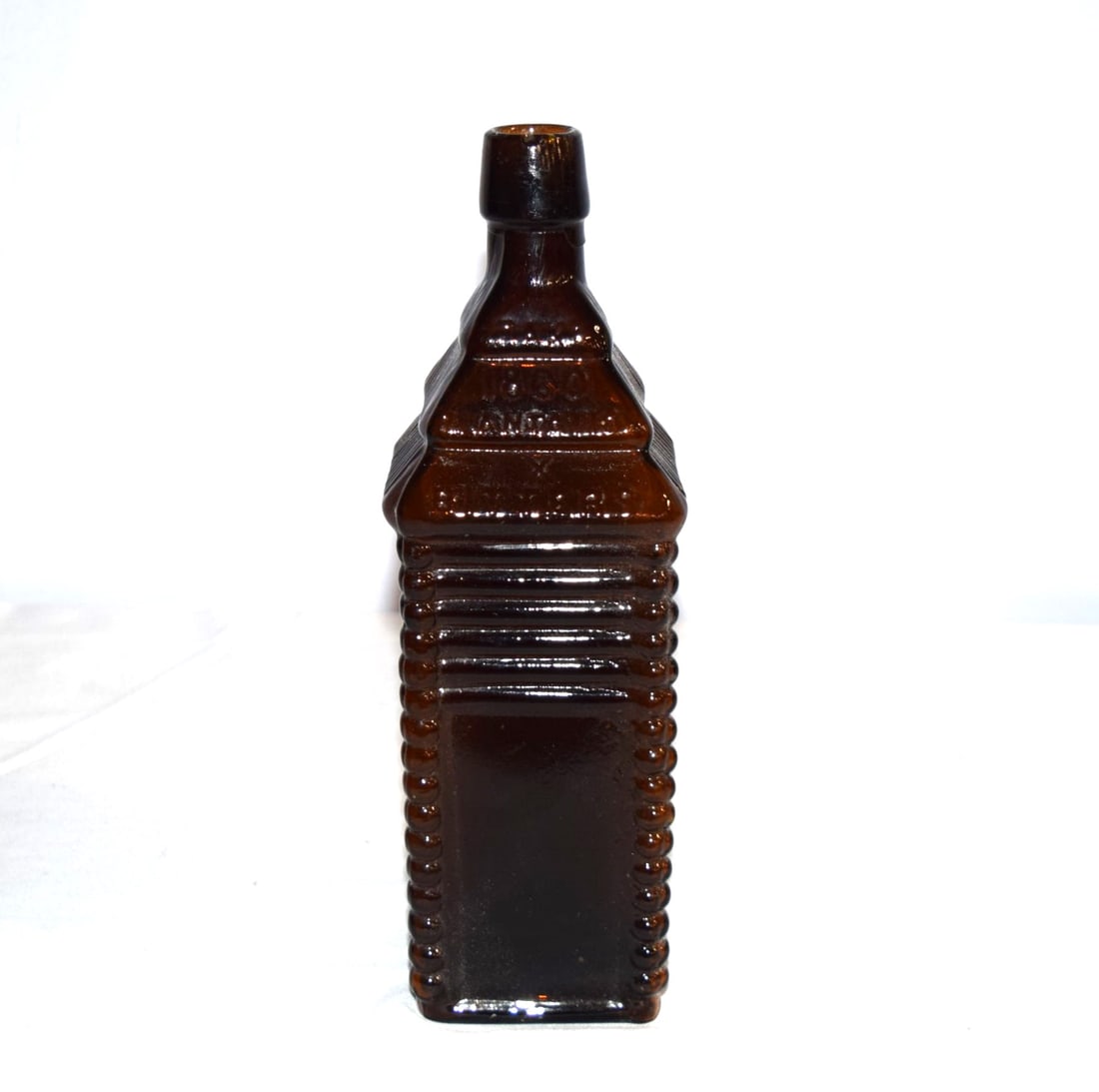 1860 Plantation X Bitters Amber Glass Bottle: 1860 Plantation X Bitters Amber Glass Bottle. Reads "Patented 1862" on one side. Measures approximately 10 inches tall X 2.75 inches square base. There are some very small chips on the opening, otherw
