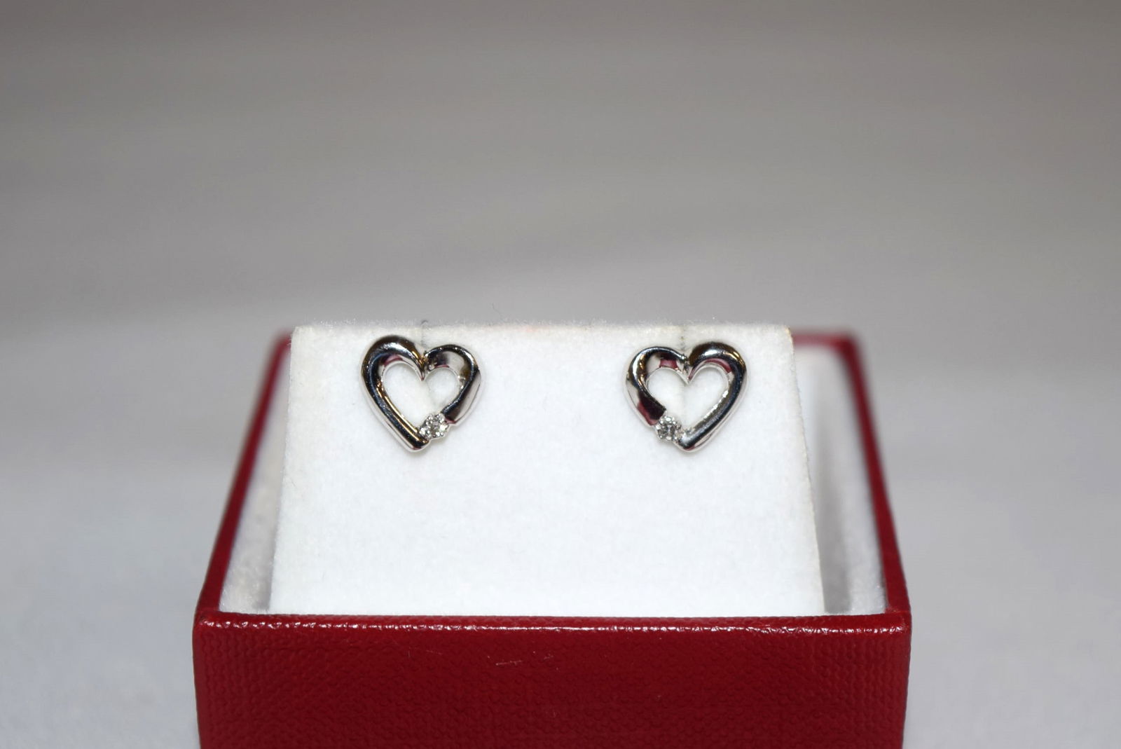 Pair of 10K White Gold Open Heart Stud Earrings: Pair of 10K White Gold Open Heart Stud Earrings measure about 9.5mm X 8.5mm. This pair of heart stud is marked, not tested, 10K and weighs approximately 1.4 grams altogether. Great pair of earrings to