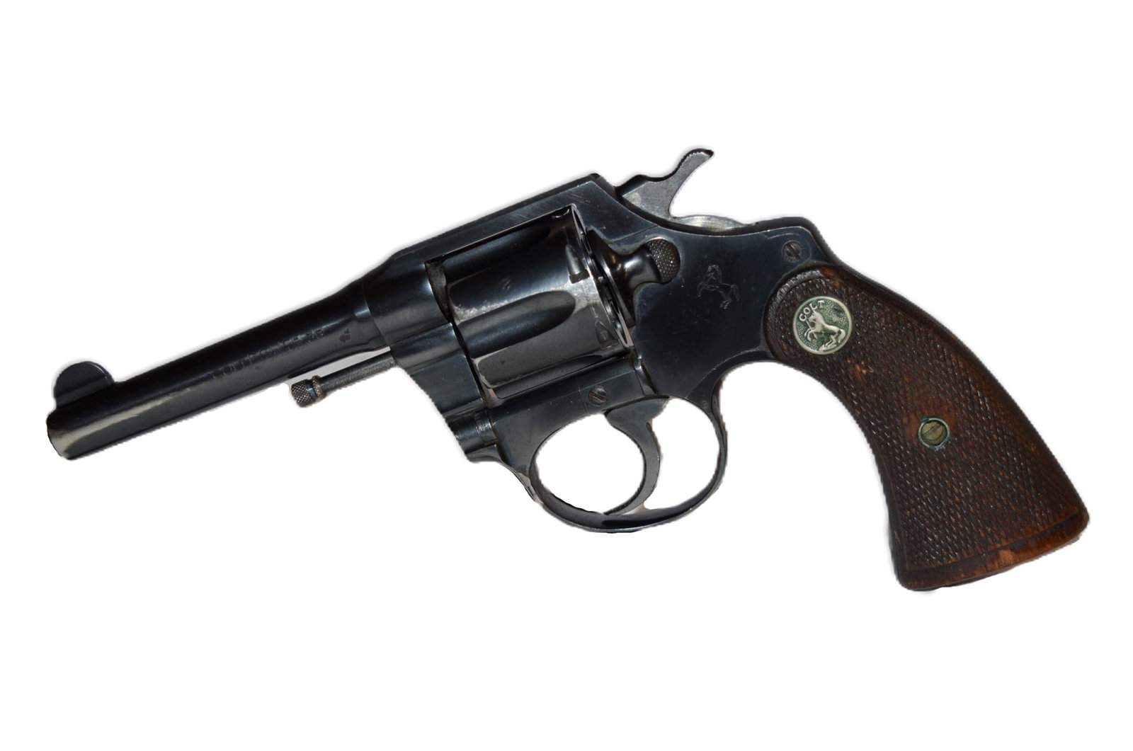 Colt Police Positive 38 Revolver: Colt Police Positive 38 Revolver. Serial Number: 332795. Revolver holds six rounds. Barrel Length: 4 Inches. Wood checkered grip. Manufactured approximately 1930. Appears to be in good overall conditi