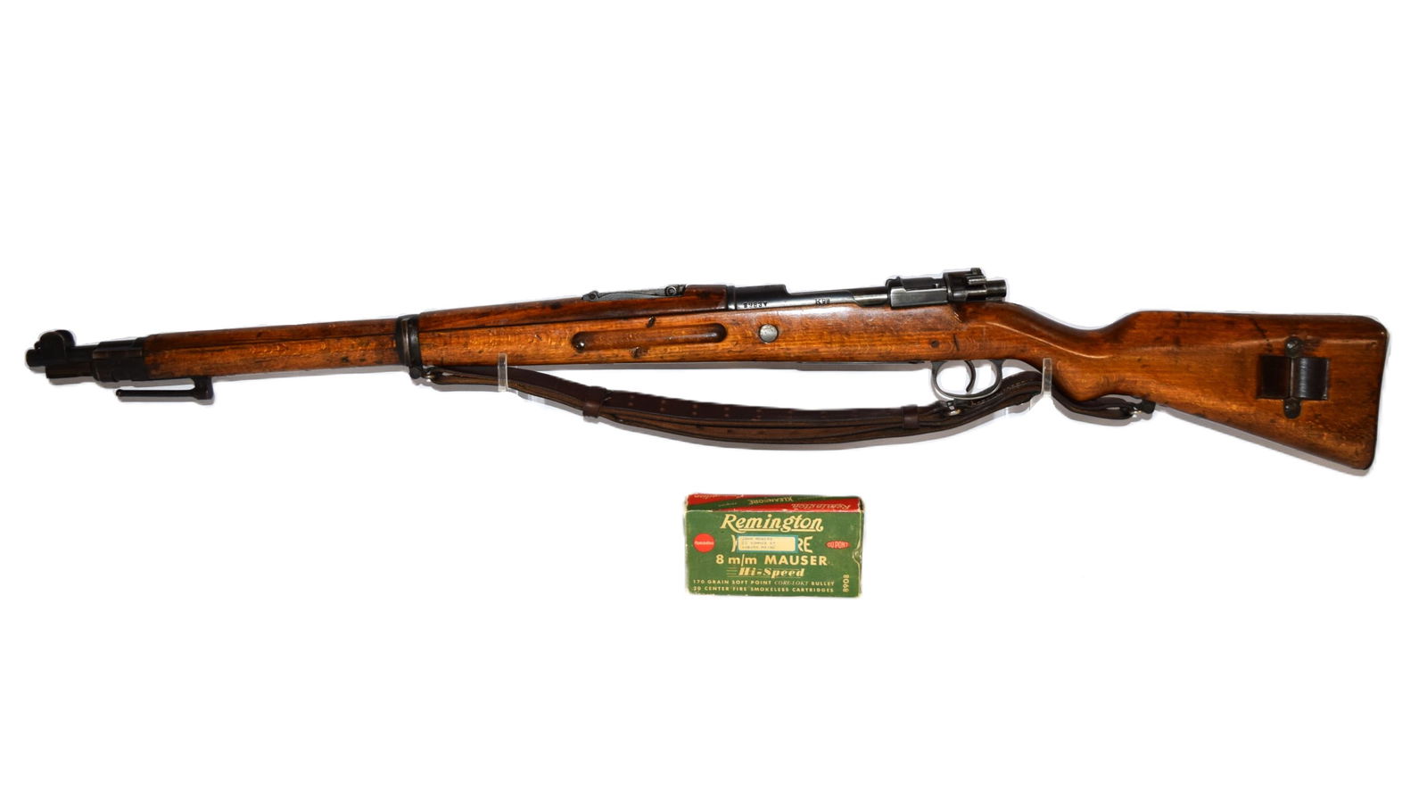 Polish Military K98 8MM Mauser: Polish Military K98 8MM Mauser. "F.B.RADOM 1928" depot stamp. Serial Number: 2983V. Barrel Length: 23.5 Inches. Wood Stock. Leather Strap still intact and attached. Comes with a box of Remington Klean