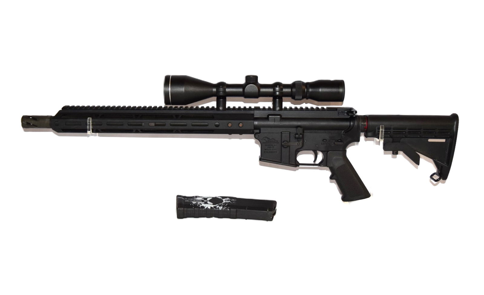 Anderson Manufacturing AM-15: Anderson Manufacturing AM-15. Serial Number: 21436098. Mounted Tasco Scope. "The Punisher" decals seen on the stock and clip. Matte Black Stock. Appears to be in good overall condition. Firearm was un