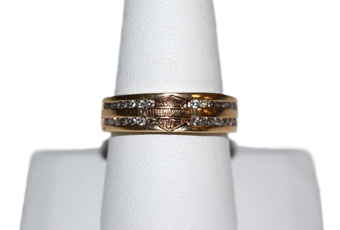 10K Yellow Gold Harley Davidson Diamond Band: 10K Yellow Gold Harley Davidson Diamond Band currently measures a size 9.75 and weighs approximately 5.2 grams. This band is full of sparkle as it is adorned with two parallel rows of small round cut
