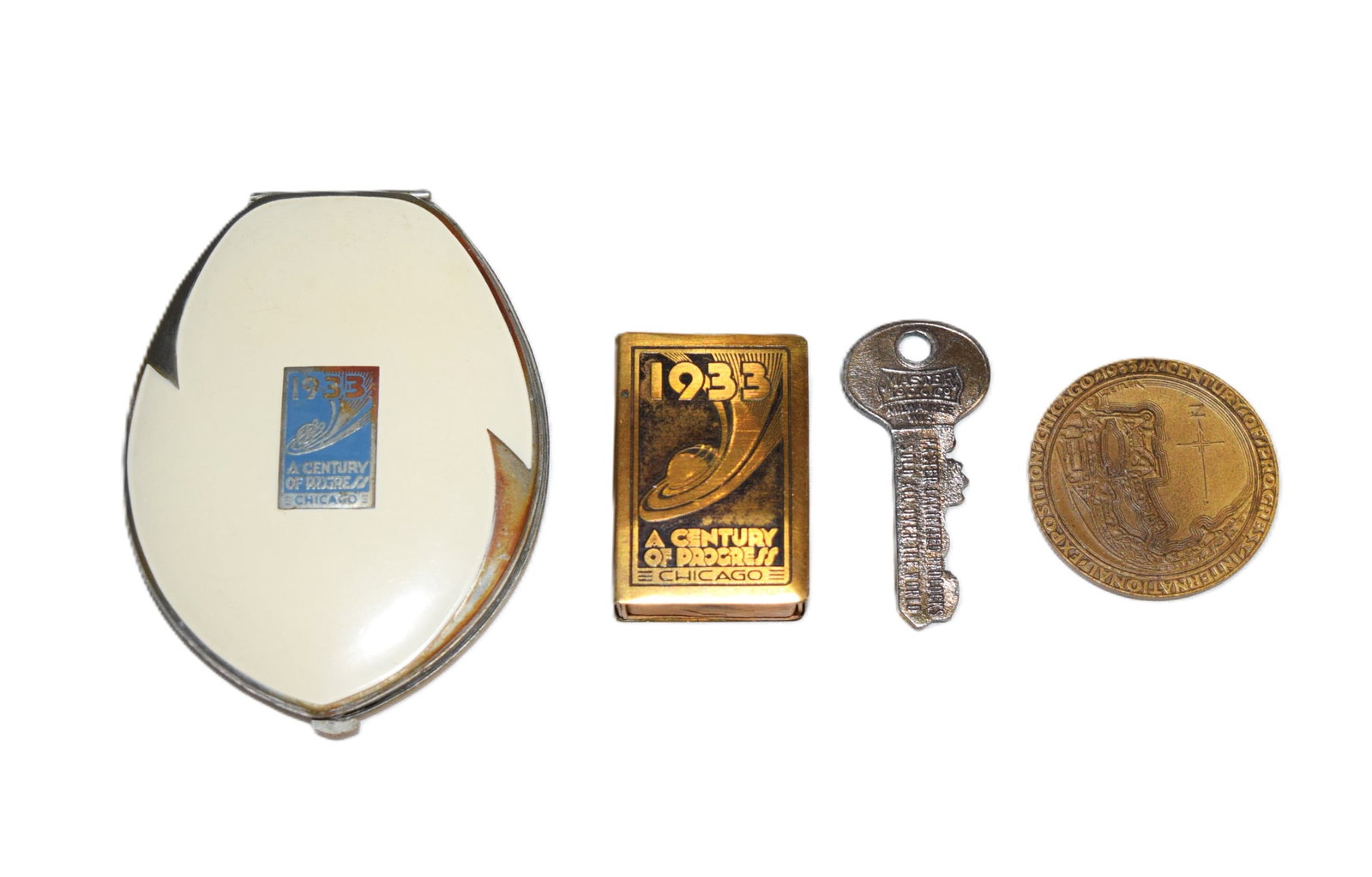 Lot of 1933 Worlds Fair Chicago Keepsakes: Lot of 1933 Worlds Fair Chicago Keepsakes includes a Elgin Vanity Compact with all original pieces still intact, a metal matchbox, a "Good Luck" key, and a Century Of Progress International Exposition