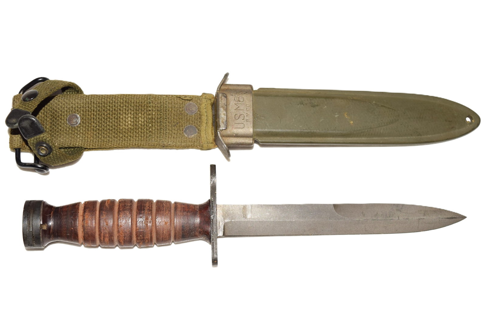 Vintage US M4 Bayonet with US M8 Scabbard: Vintage US M4 knife measures 11.75in L, blade 6.75in L. Hilt is embossed US M4 PAL. The scabbard is embossed with slightly different markings: US M8 B.M.Co. Overall knife and sheath appears to be in g