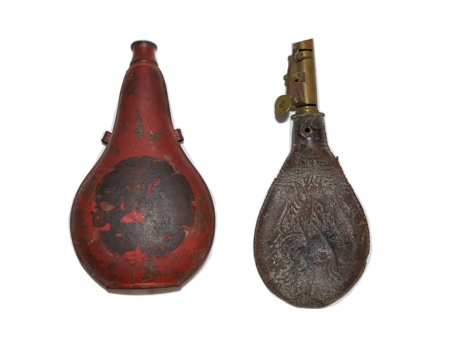 AM Flask & Cap Co. and Antique Red Painted Black Powder Flask: Lot includes a American Flask & Cap Co. Gunpowder Flask with a Hunting Dog Scene on one side measuring approximately 7.5 inches in length overall X 3.25 inches wide and a Antique Black Powder Flask in