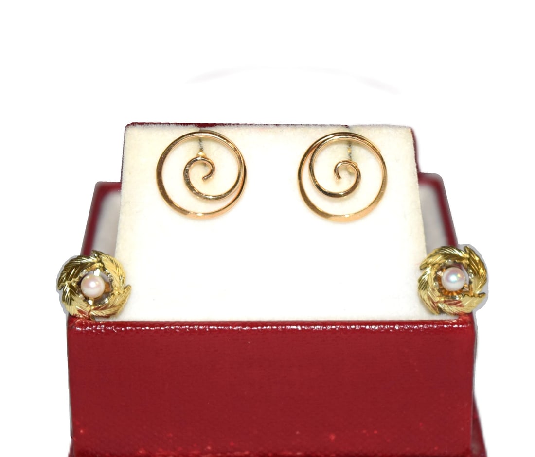Lot of Two Pairs of 14K Yellow Gold Estate Earrings: Lot of Two Pairs of 14K Gold Estate Earrings include a pair of 14K Yellow Gold Pearl Studs with a halo of gold leafs wrapped around it measuring 9.5mm round which were tested but unmarked, 14K, along