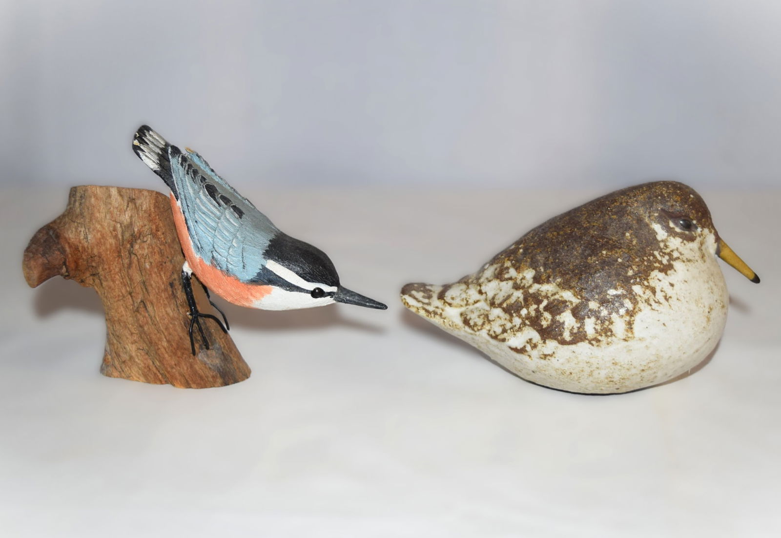 Anderson Design Pottery Sandpiper and Wooden Carved Painted Red-Breasted Nuthatch: Anderson Design Pottery Sandpiper and Wooden Carved Painted Red-Breasted Nuthatch. The Anderson Design Studio pottery piece is signed on the base "AD" and measures approximately 5.75 inches long from