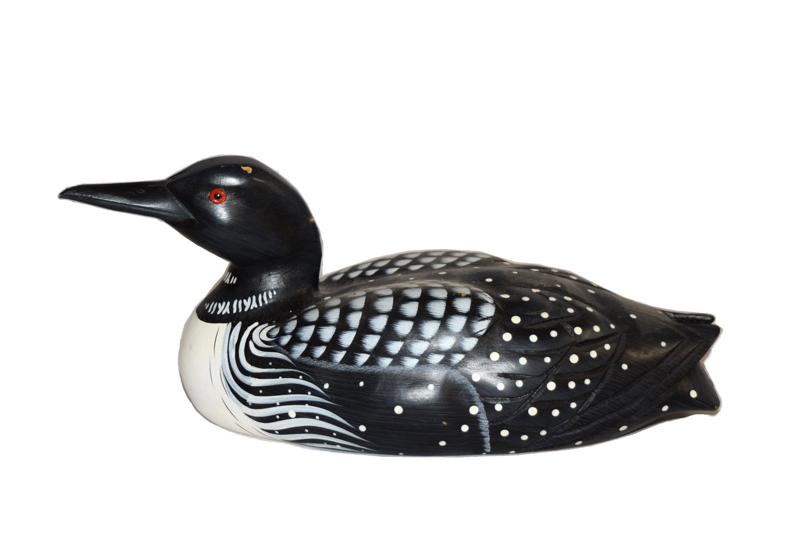 Paint Decorated Hand Carved Loon Decoy: Paint Decorated Hand Carved Loon Decoy measures approximately 10 inches X 4.5 inches X 5 inches tall overall. Features carved feather detail for a dimensional realistic appearance and detailed paint d
