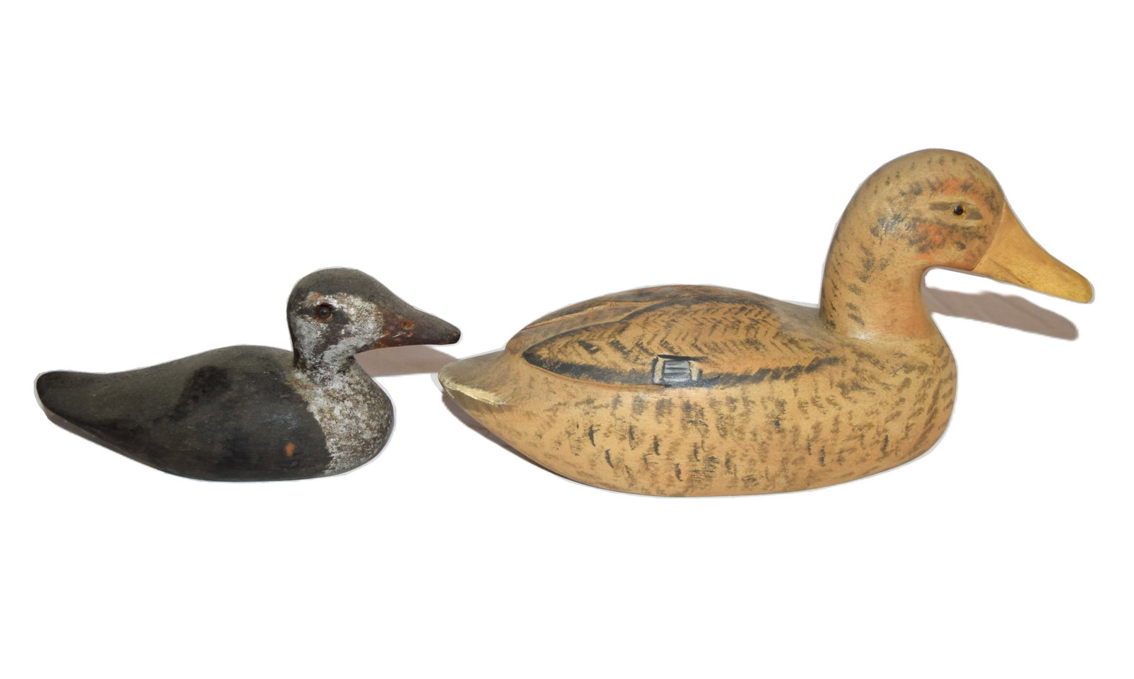 Lot of Two Vintage Antique Wooden Carved Paint Decorated Duck Decoys: Lot of Two Vintage Antique Wooden Carved Paint Decorated Duck Decoys. The larger of the two is both signed and dated on the bottom by artist and measures approximately 9.5 inches beak to tail X 3 inch