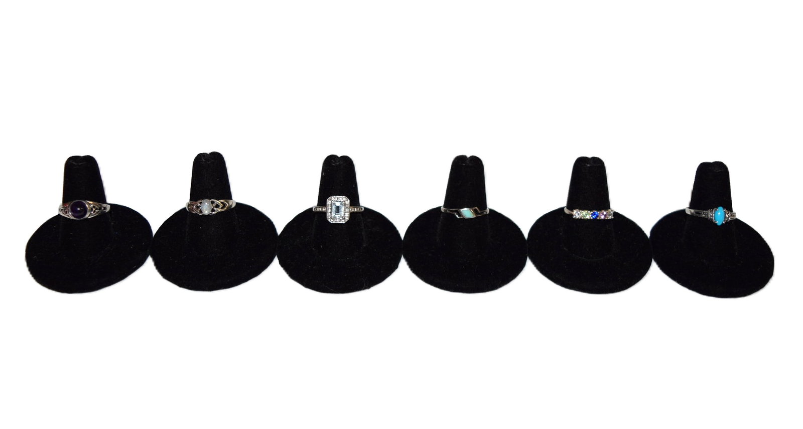 Lot of Six Sterling Silver Estate Rings: Lot of Six Sterling Silver Estate Rings includes a great variety of styles and color, with something for every mood and outfit! Five of the rings currently measure a size 7, with the last measuring a 