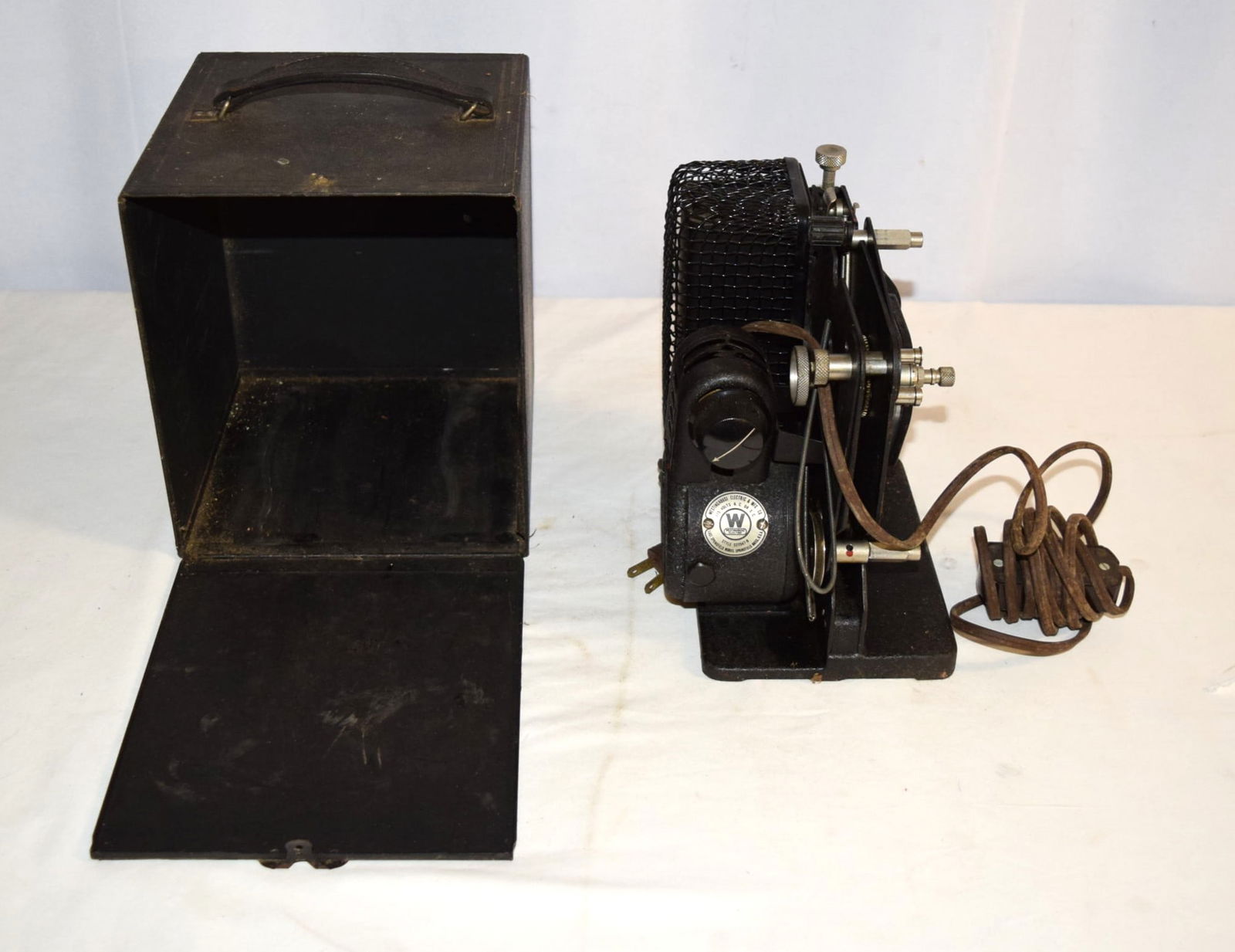 Antique Eastman Kodak Co. Kodascope Model C Movie Film Projector: Eastman Kodak Co. Kodascope Model C Movie Film Projector comes with its original storage box which measures approximately 7.5 inches square X 8.5 inches tall overall and reads "KODASCOPE" along the ca