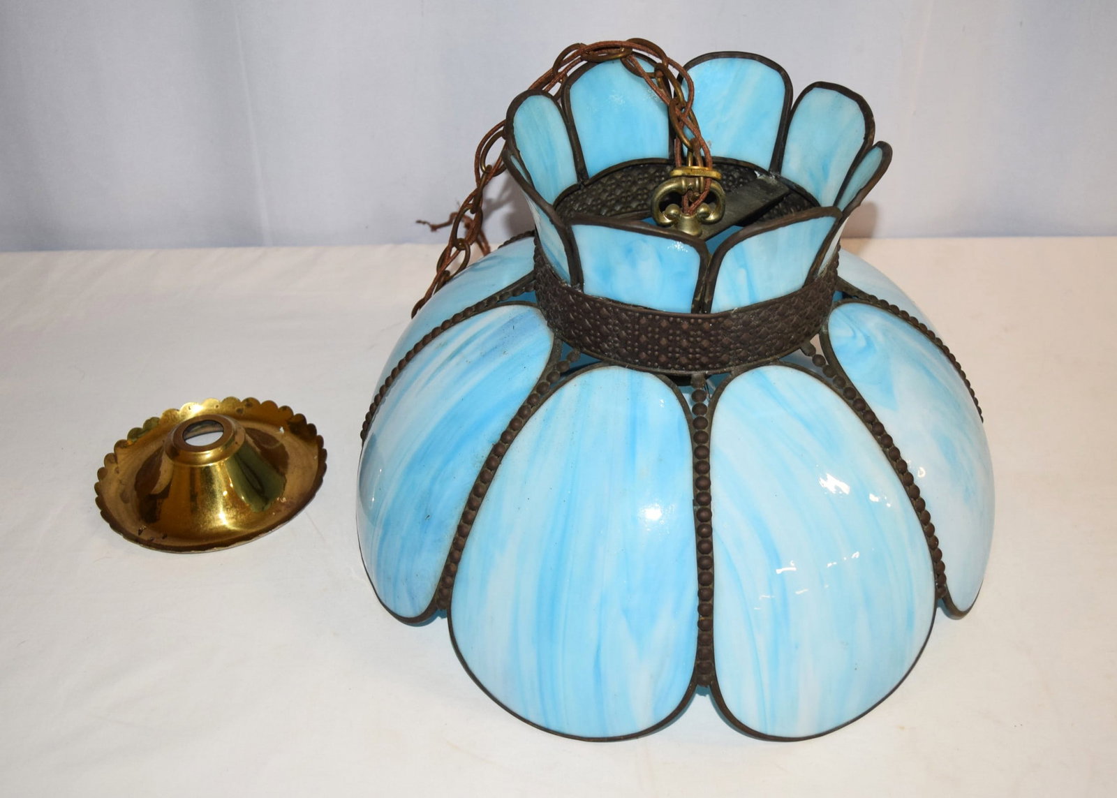Mid Century Modern Stag Glass Baby Blue Chandelier: Mid Century Modern Stag Glass Baby Blue Chandelier measures approximately 11.5 inches tall X 17.5 inches round on base X 9 inches round on top X 20 inch long chain X 6.5 inches round on the brass piec