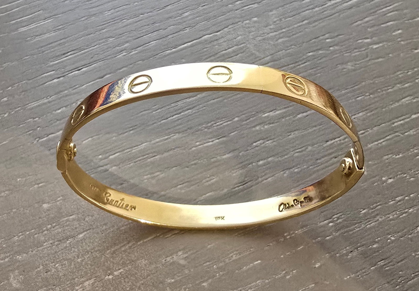 Vintage Cartier Aldo Cipullo 18K Gold LOVE Bracelet, Early 1970 Production, Signed, Size 16: Designed by Aldo Cipullo for Cartier, this desirable early LOVE bracelet is crafted in solid 18k yellow gold and represents one of the first-generation New York production examples. These early bracel