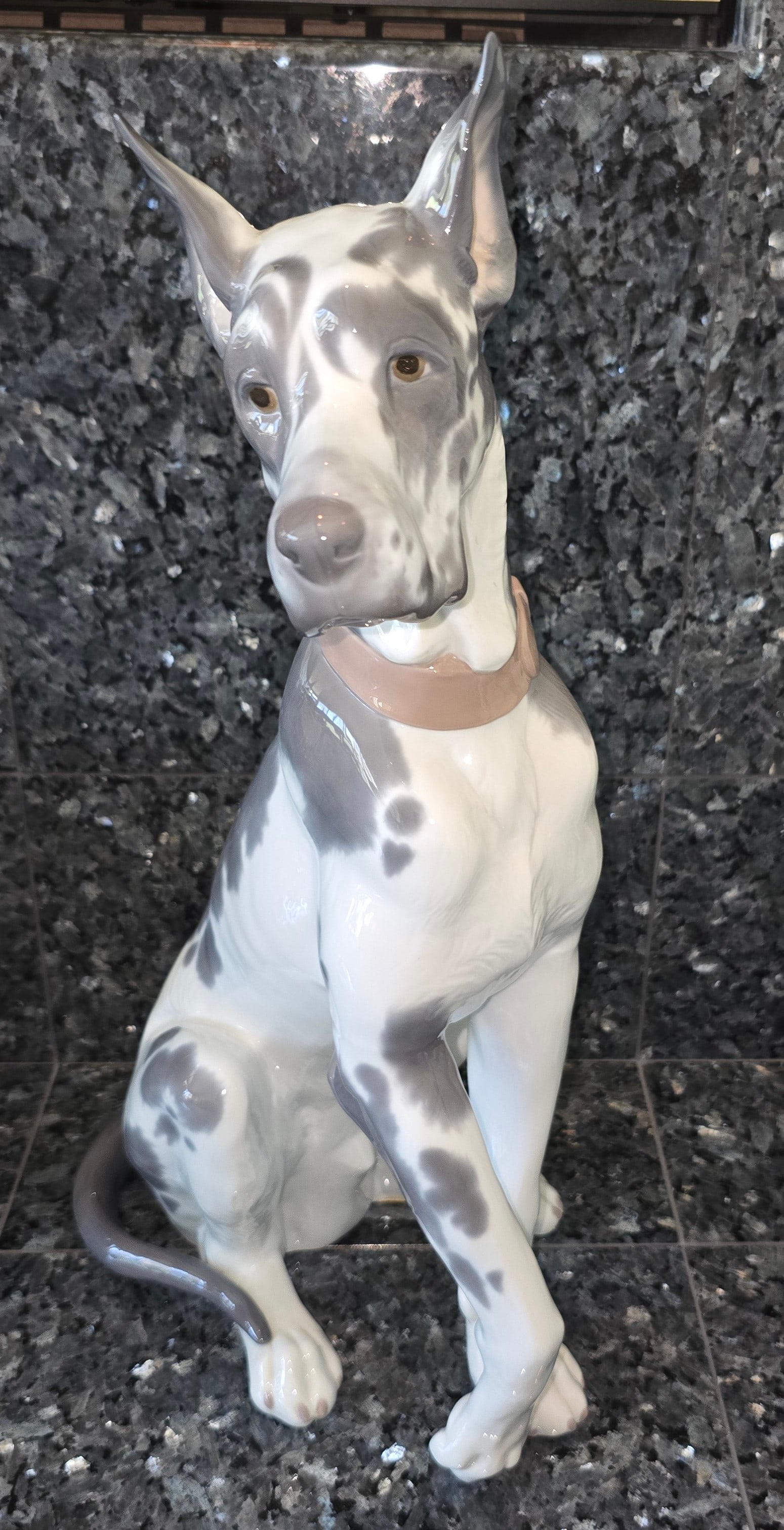Lladró #1068 Great Dane Porcelain Figure: ITEM DESCRIPTION Title: Great Dane Maker: Lladró, Spain Model Number: #1068 Sculptor: Juan Huerta Retired Lladró porcelain figure depicting a reclining Great Dane. Issued in 1969 and retired i