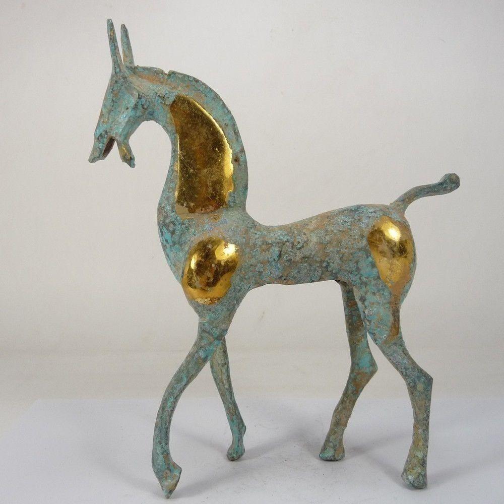A BRONZE GILDED HORSE STATUE HAN DYNASTY 1ST/C.: HEIGHT 20.5/CM LONG 16.5/CM
