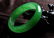 A NATURAL GREEN JADE BANGLE. - 4