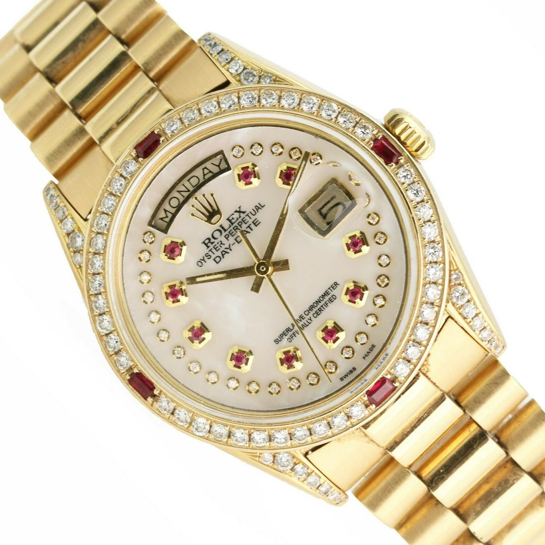 A ROLEX 18KT GOLD AND RUBY & DIAMONDS MAN WATCH.: [BRAND] Rolex [MODEL] Day-Date 1803 [GENDER] Men's [CASE SIZE] 36mm [BOX] TPC Watch presentation watch box [PAPERS] TPC Watch appraisal and certificate of authenticity [BRACELET LENGTH] 7.5 Inches. Ad