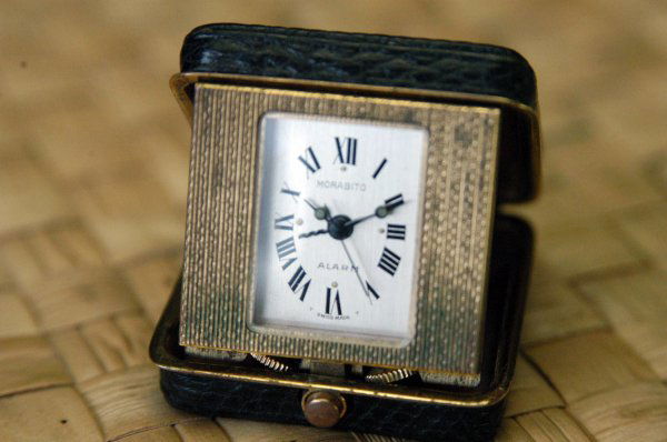 Morabito Swiss travel clock: This diminutive clock has a leather case. It measures 1.5" x 1.5". There is a second hand. It is in a brass case